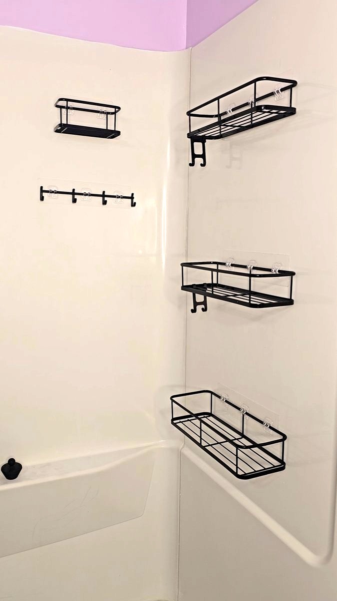 YASONIC black adhesive shower shelves on the shower wall