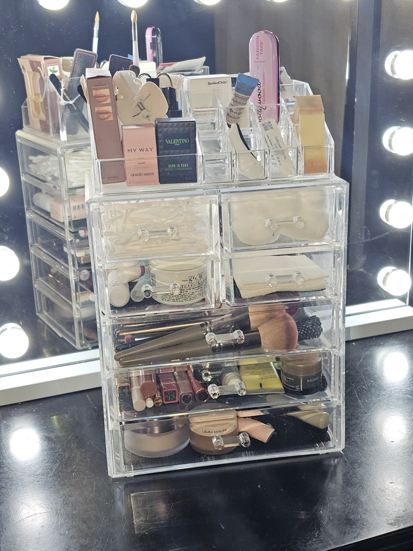 Sorbus clear acrylic makeup organizer full of makeup on a vanity