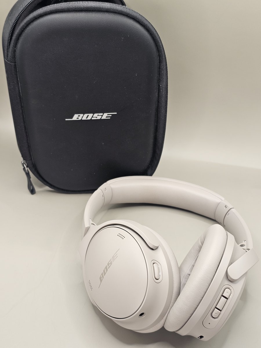 Bose QuietComfort headphones in White Smoke with their zip case